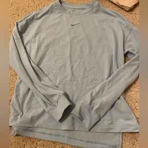 this is a great Nike shirt, the material is thin and it is a baby blue color